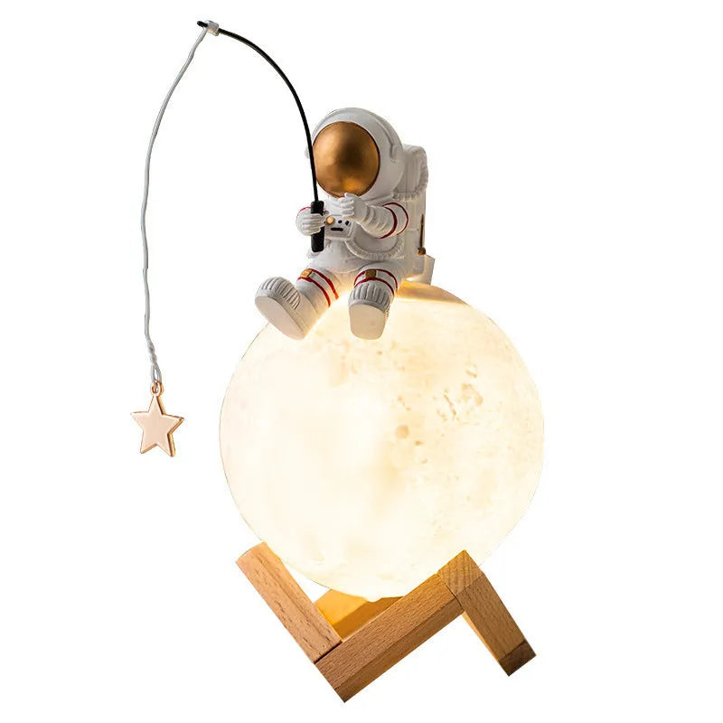 Gold astronaut resin figurine USB humidifier and night light on a wooden base
