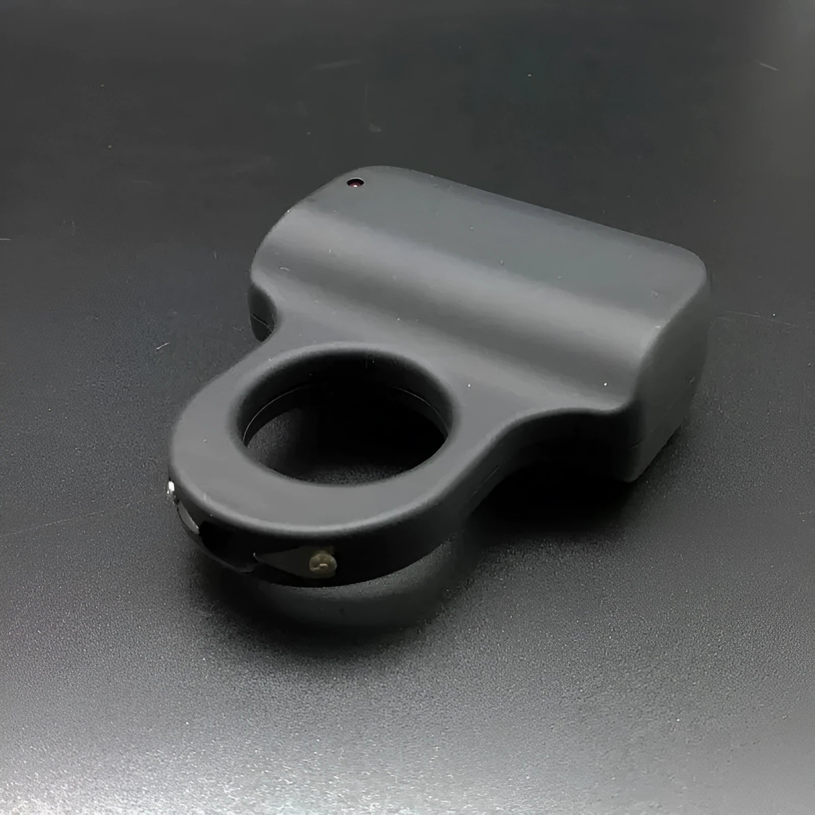 Black alloy cheetah design electric shock ring toy with fingerstall on hand