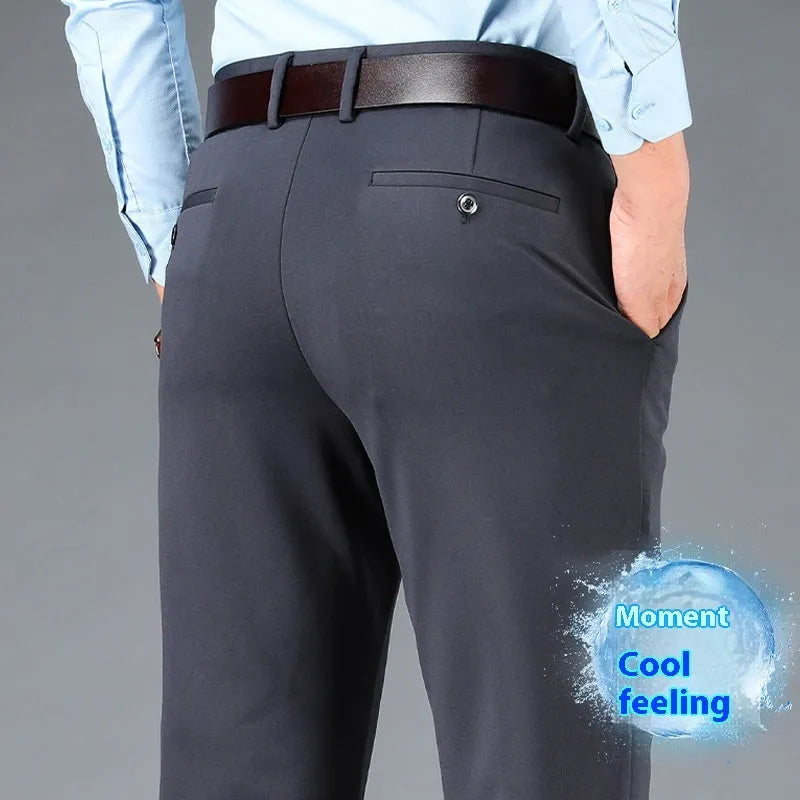 Men's plus-sized straight-leg trousers in navy blue with an elasticated waistband, shown with a zip fly and business casual styling.