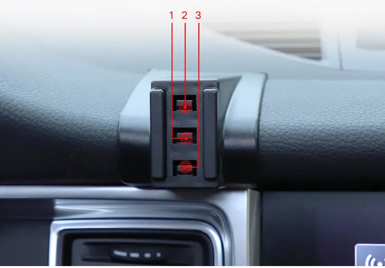 Gravity linkage car phone holder for Porsche in black alloy and carbon fibre, with phone mounted for navigation