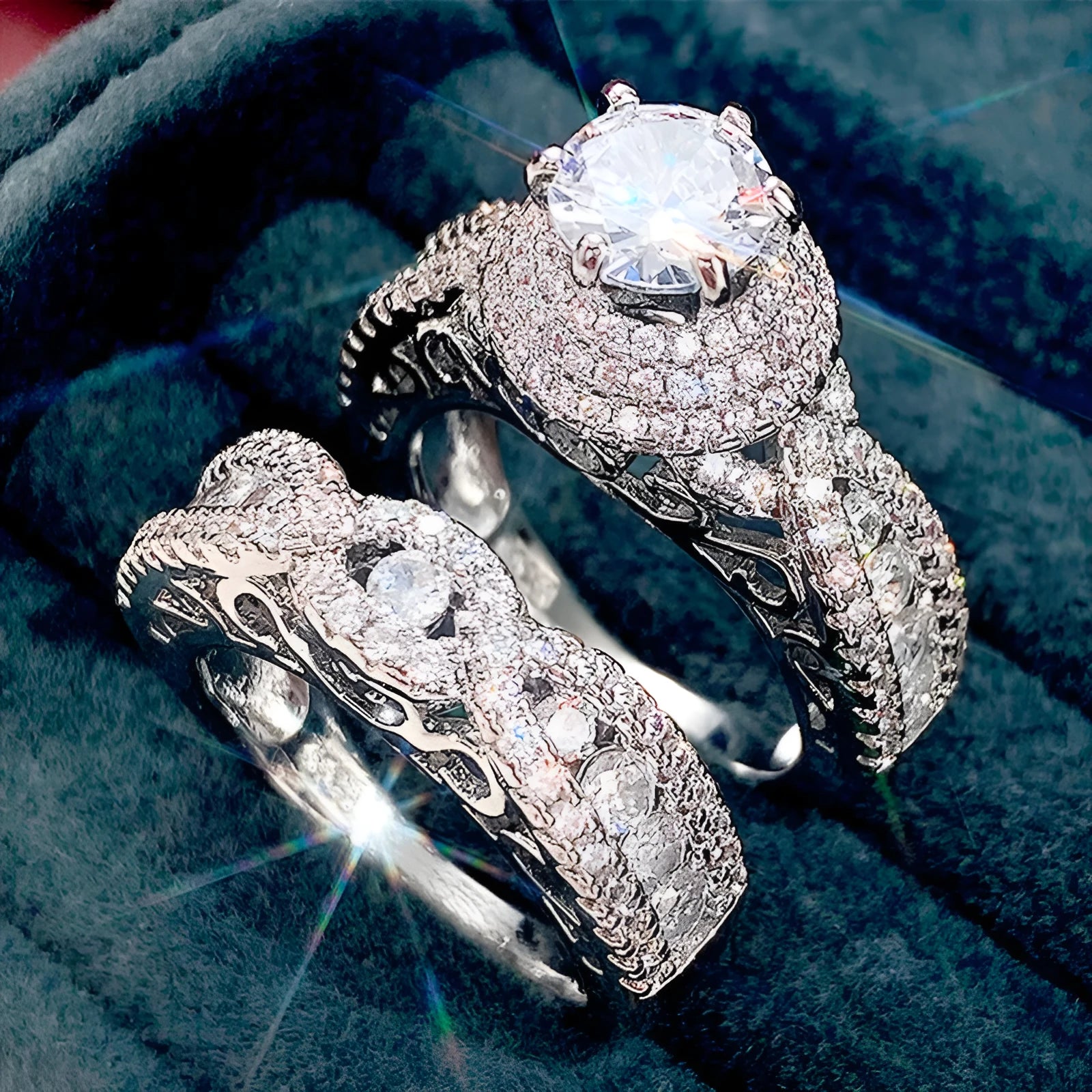 Pair of white gold colour copper couple rings with inlaid zircon stones, geometric U-shaped design on white background