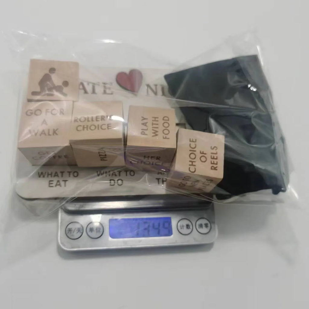 Wooden date night dice set showing five wooden dice, a rectangular planner board, and a black storage bag.
