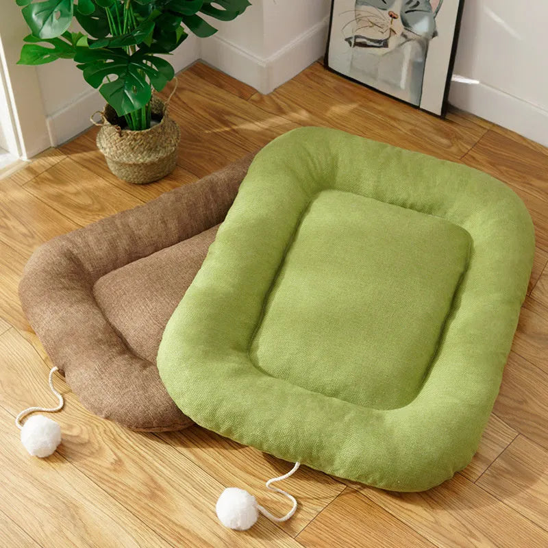 Brown and green pet cushion with removable cover shown in four sizes for small to medium dogs and cats