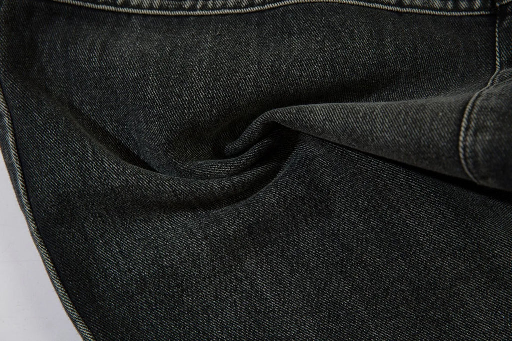 Black men's cotton wide-leg loose-fit trousers with embroidery on a mannequin.