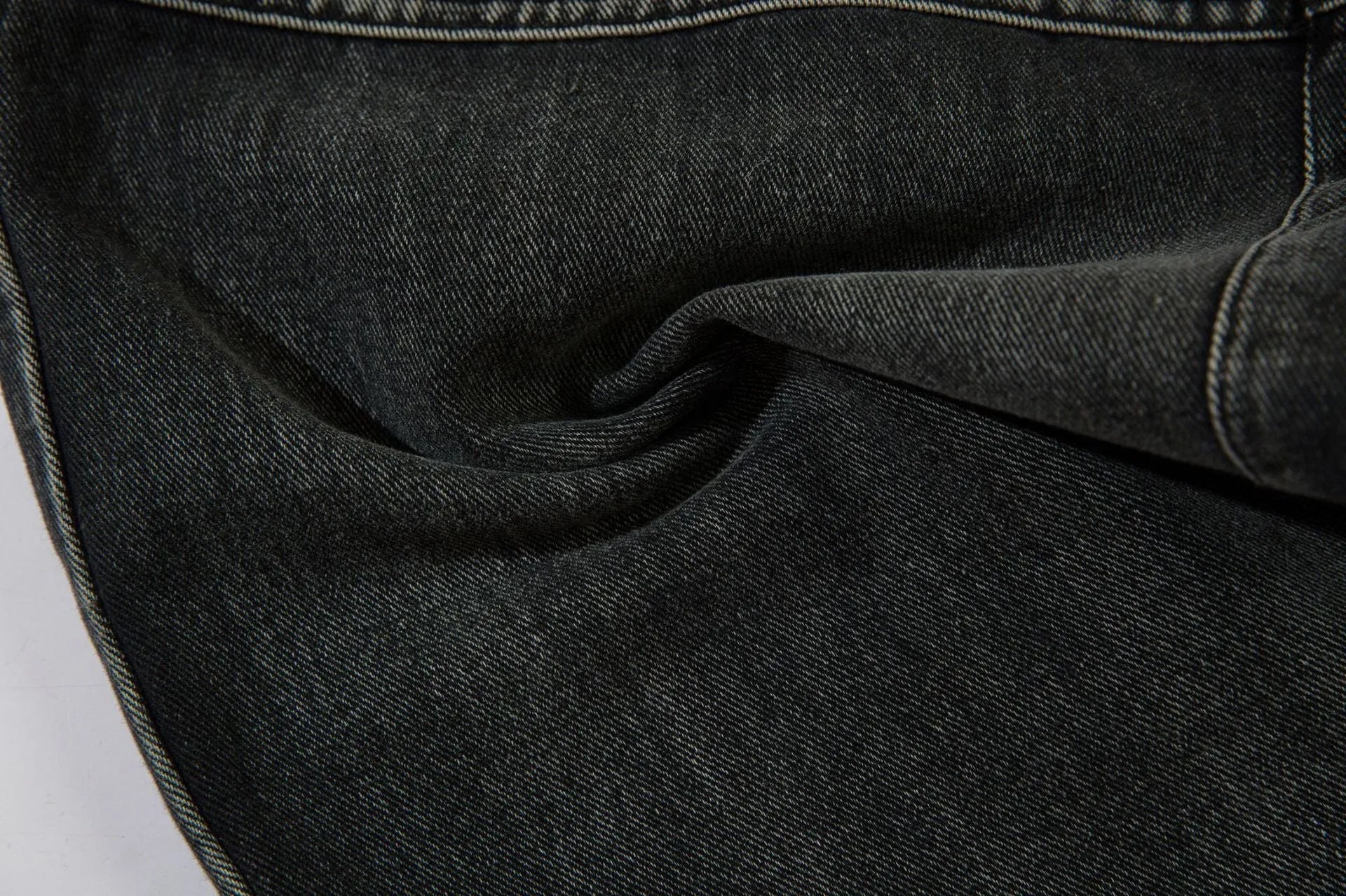 Black men's cotton wide-leg loose-fit trousers with embroidery on a mannequin.