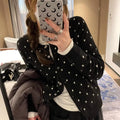 Women's grey Korean-style cardigan with crocheted flower detail on mannequin