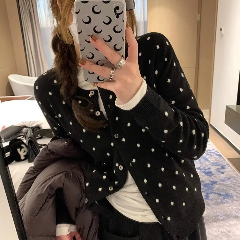 Women's grey Korean-style cardigan with crocheted flower detail on mannequin