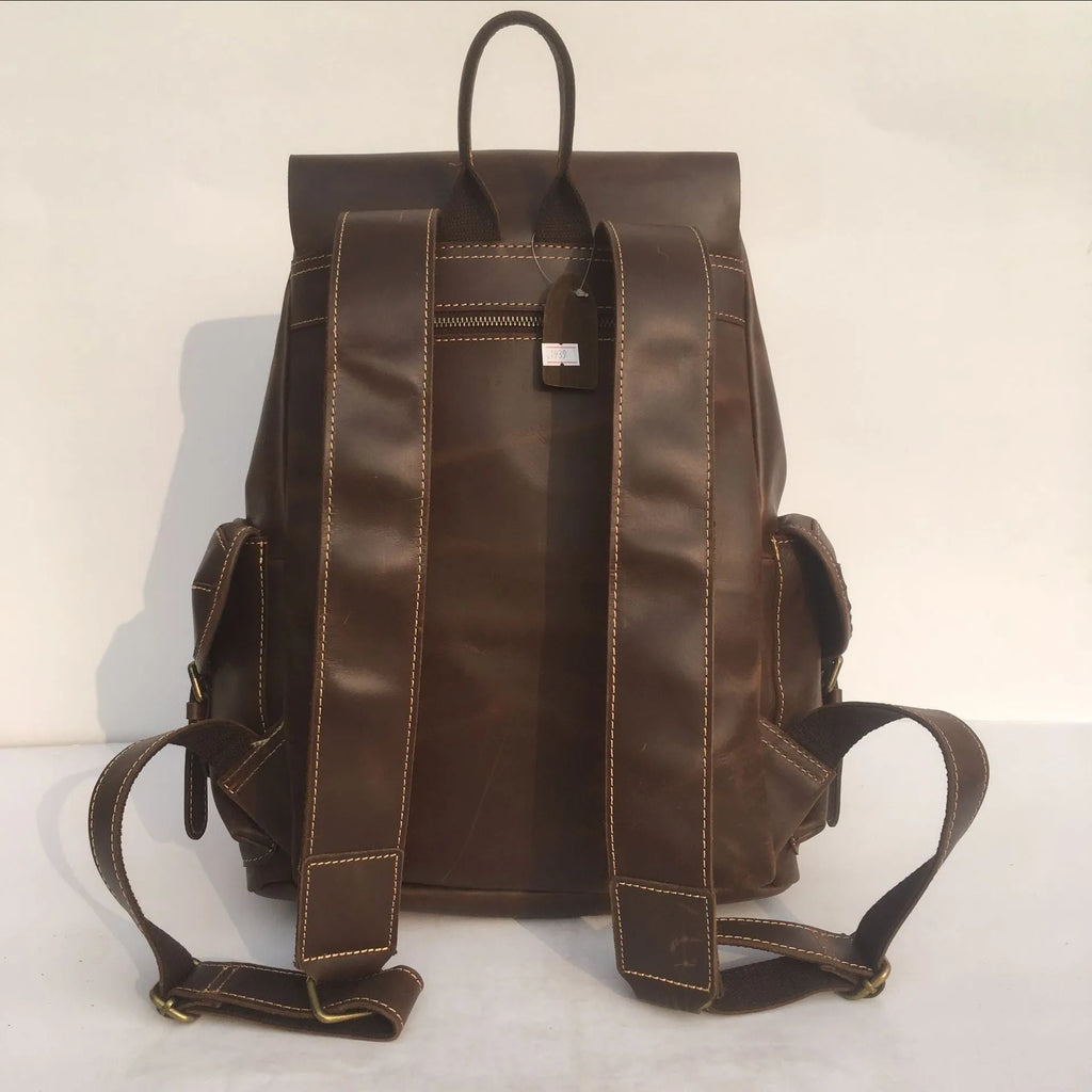 Brown genuine leather men's backpack with an air pillow belt system on the straps.