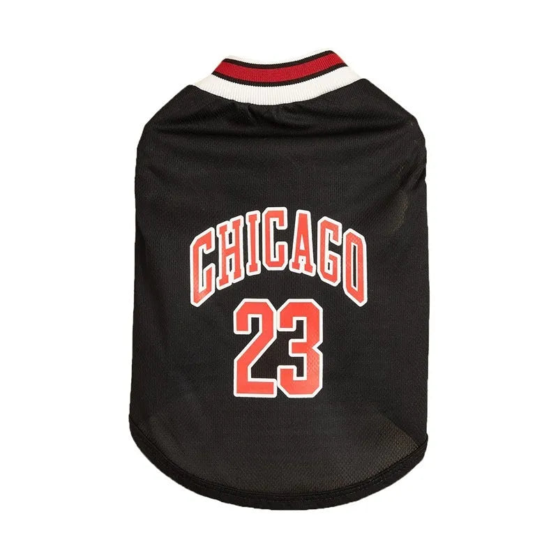 Dog wearing a black mesh polyester basketball vest with number 23 print, side view