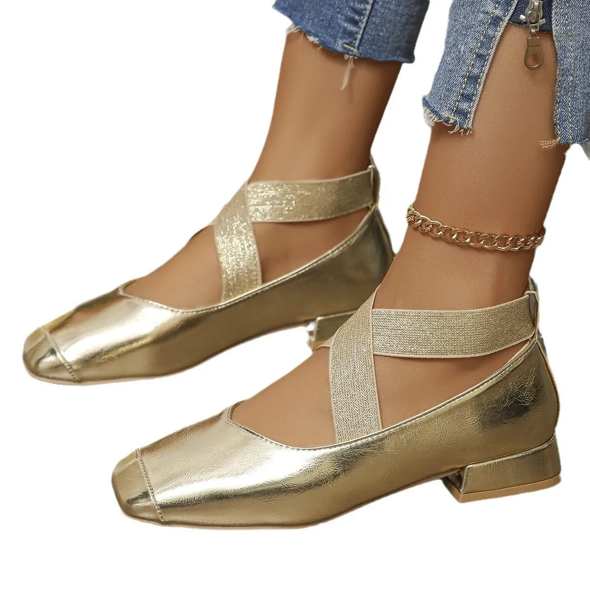 Gold slip-on square toe evening pumps with a low heel on a white background.