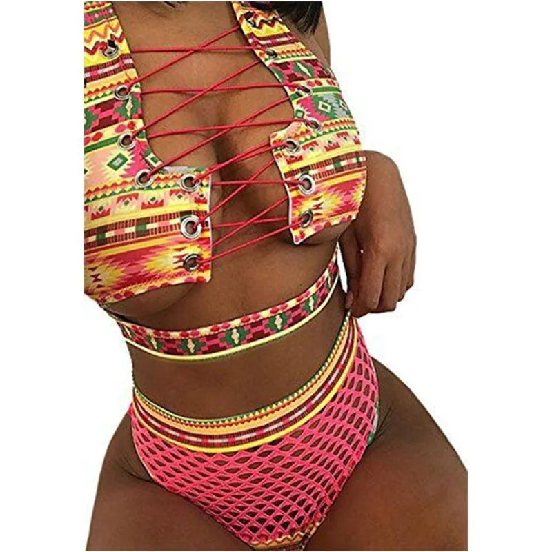 Women's multicolour checkered bikini set with cross-strap bra and high-waist fishnet briefs on a neutral background.