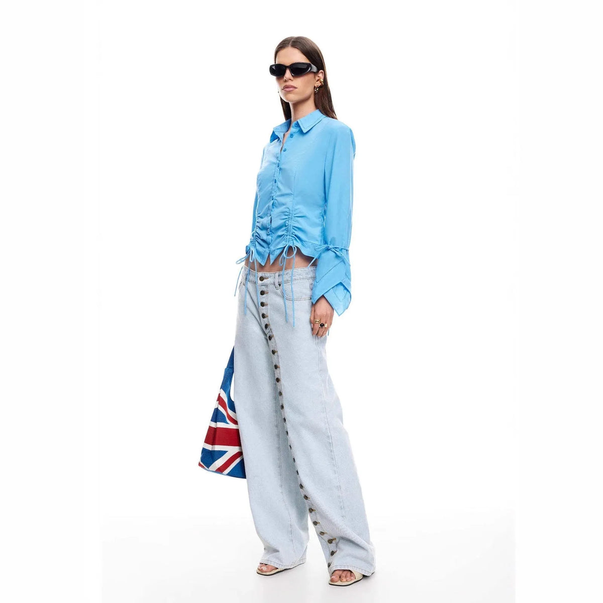 Women's straight-leg multi-button low-waist jeans in blue stone-washed cotton denim, side view