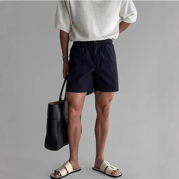 Cotton loose fit sports shorts in black, white, and khaki colours for summer athletic wear