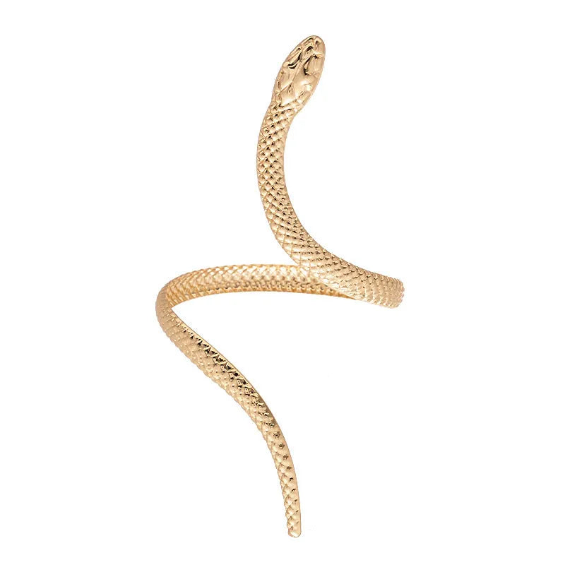 Gold exaggerated twisted snake design bracelet and ring jewellery set on a dark background.