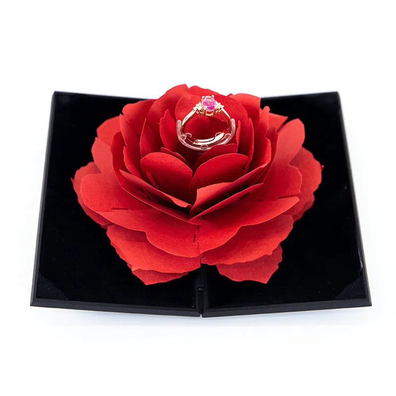 Red heart-shaped rotating ring box with 3D love motif and rose decoration for jewellery packaging