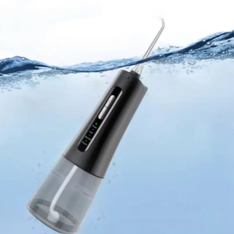 Black rechargeable oral irrigator with 300ml to 400ml tank and four nozzles on white background