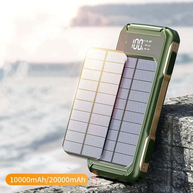 Black military grade mobile power bank showing size next to a smartphone, with green and orange colour variants.