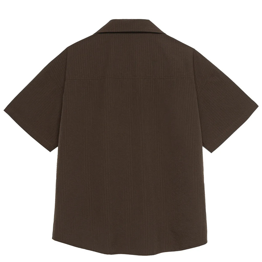 Brown striped outdoor short sleeve shirt with Cuban collar on a hanger.