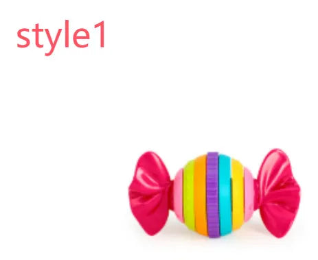Ten baby rattles in various multicolour styles arranged on a white background, showing different colours and shapes for infant grasping