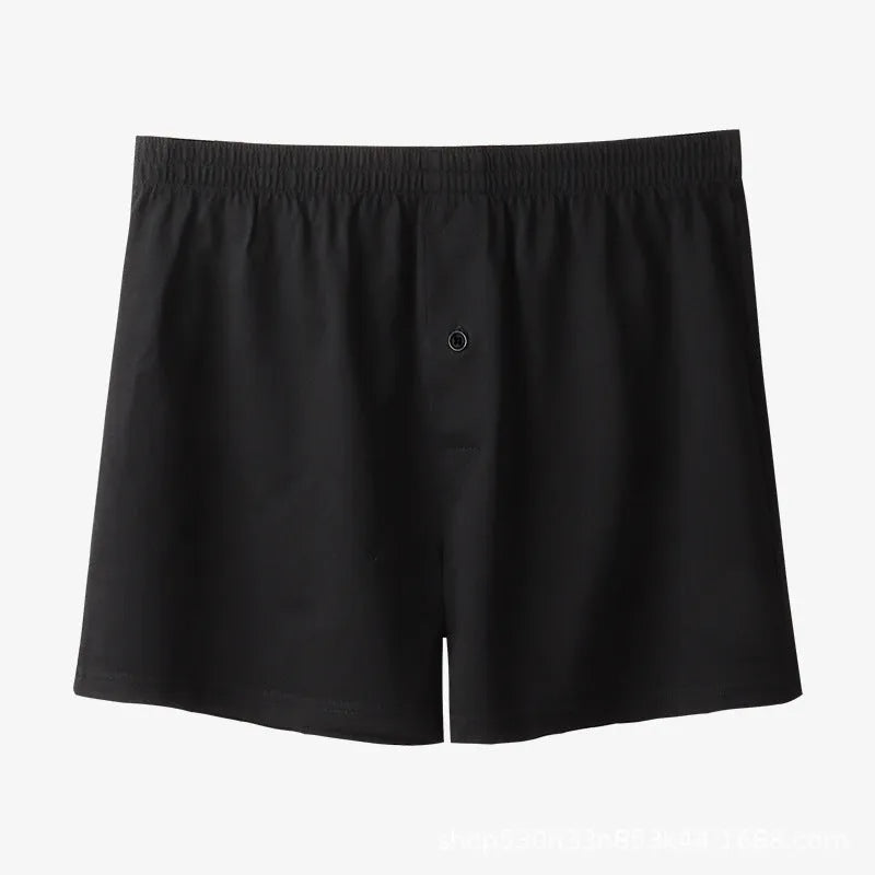 Men's solid colour cotton boxer shorts on a white background, showing loose fit and high waistband.