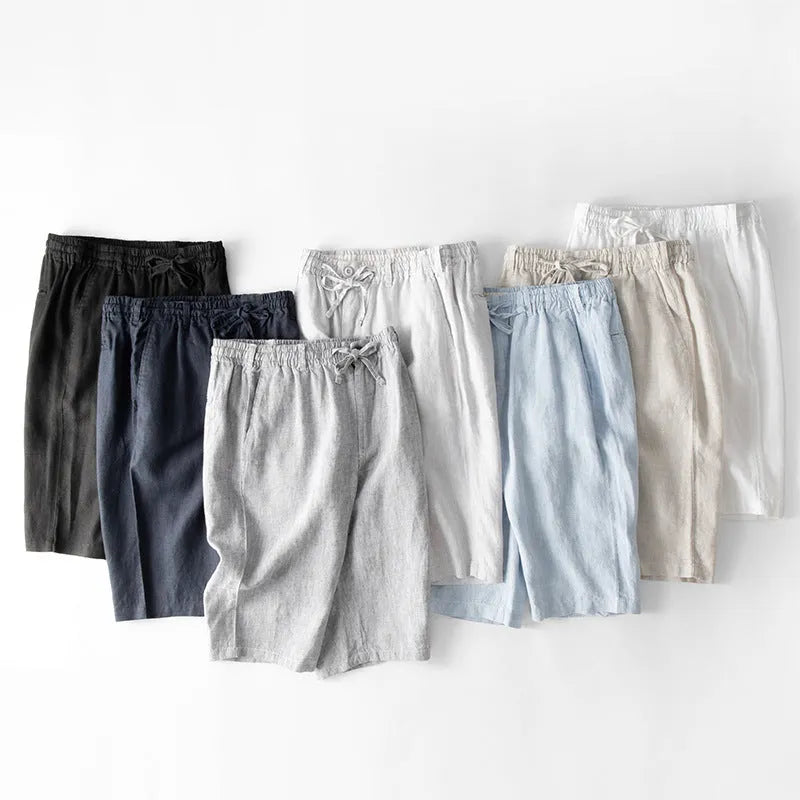 Men's loose-fitting linen capri trousers in a straight-leg style on a neutral background.