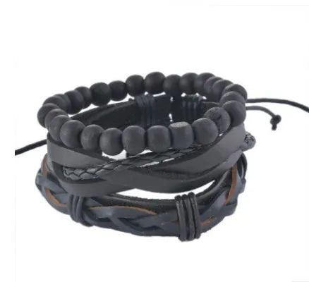 Handmade adjustable leather wrap bracelet with wooden beads on a wrist.