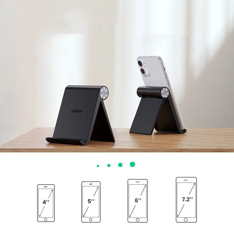 UGREEN Lazy Bracket portable phone holder in black on a desk, holding a mobile phone.
