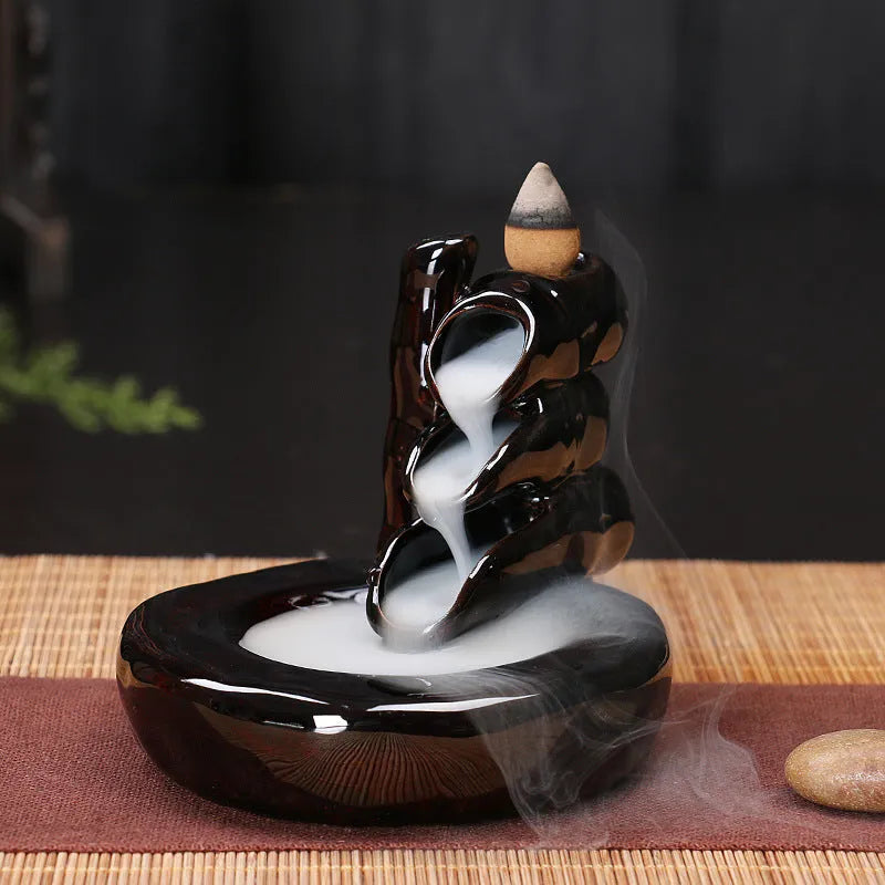 Ceramic backflow incense burner with black glaze finish and waterfall smoke effect