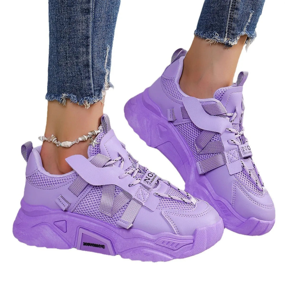 Women's purple platform mesh sports shoe with front lace-up, shown on a white background.