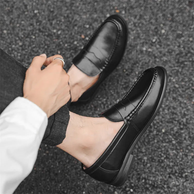 Men's black casual slip-on leather shoes with soft bottom and sewing line detail on a clean background