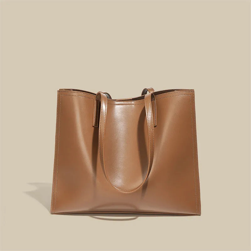 Brown genuine leather one shoulder handbag with horizontal square shape showing multiple internal compartments
