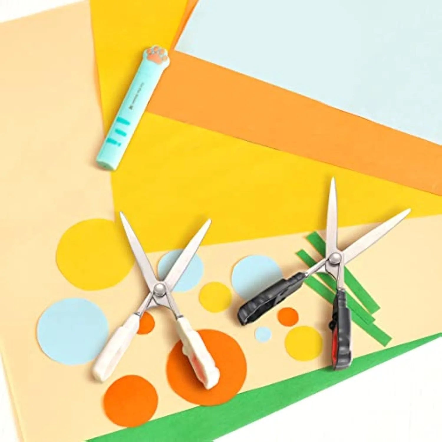 Cat paw design mini folding scissors in four colours showing stainless steel blades