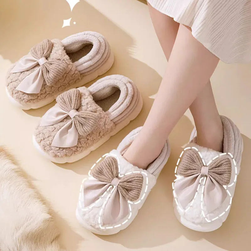 Big bow-knot fluffy slippers with covered heel in pink colour on floor