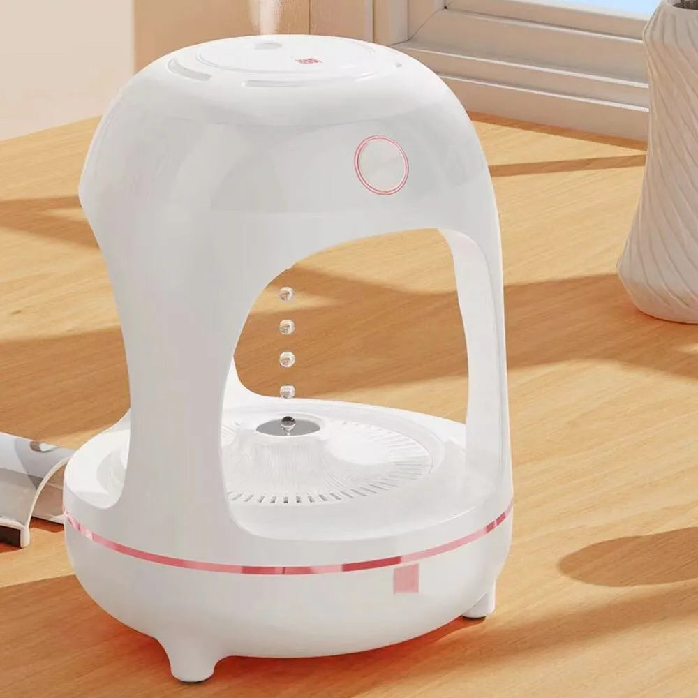 Rose gold and white levitating water drops ultrasonic humidifier and LED night light on a desk