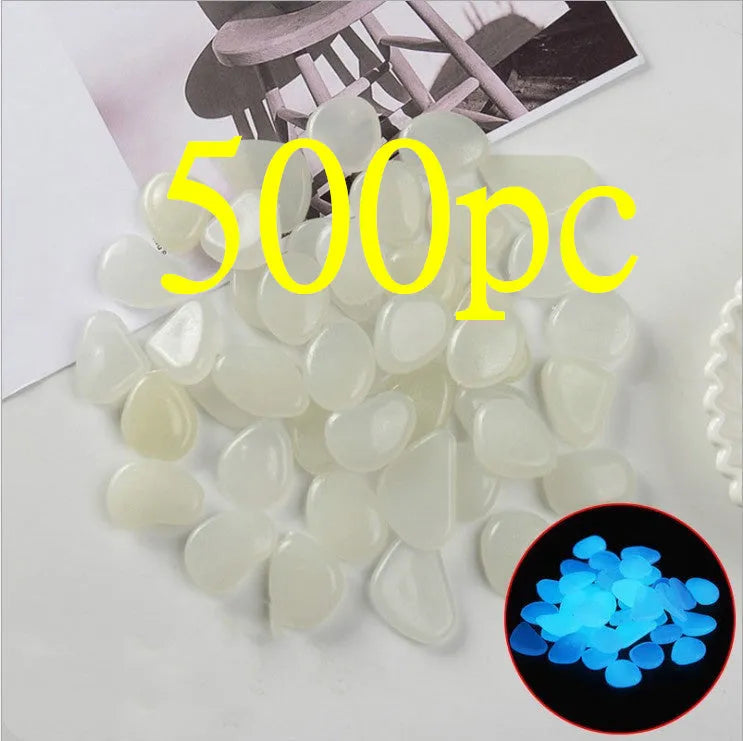Luminous fluorescent aquarium and garden pebbles in mixed colours including dark purple, yellow, light blue, pink, orange