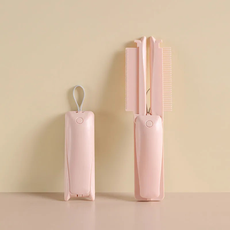 Pink and white ABS plastic pet grooming brush for dogs and cats on flat surface