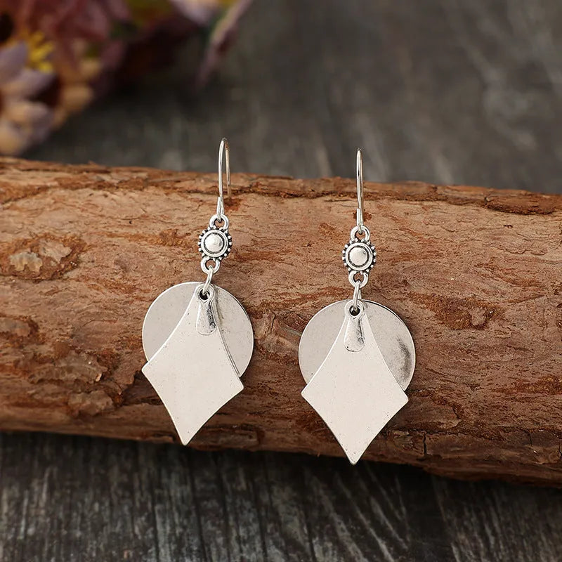 Silver geometric alloy earrings with layered retro design and round shape