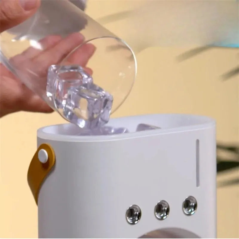 White portable USB humidifier fan with remote control on a desk