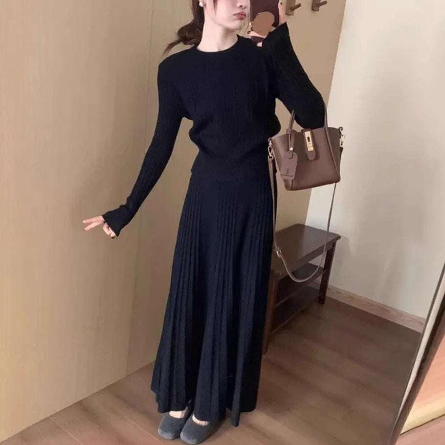 Dark grey knitted two-piece dress suit with 3D pattern, featuring a sweater and skirt in retro ethnic style.