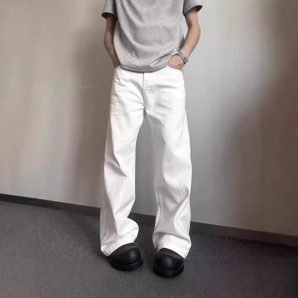 Men's white straight leg jeans with mid-rise waist and zipper fly closure