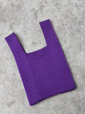 Soft polyester hollow knitted handbag for women with open-weave texture, shown in one of nine colour options