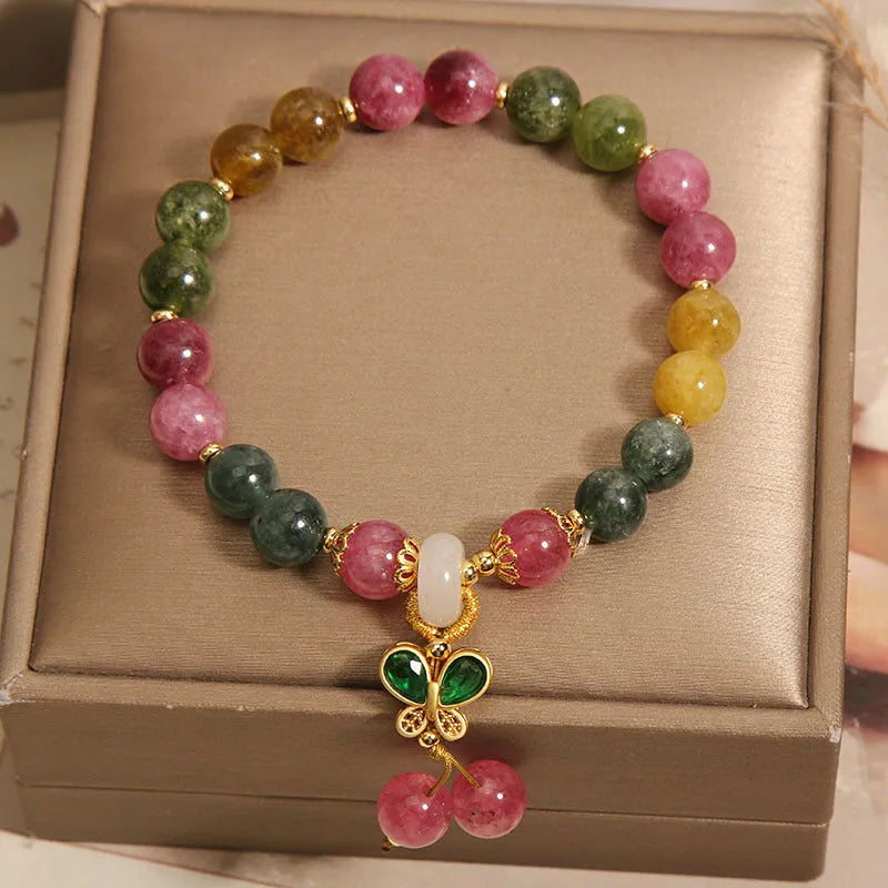 Women's tourmaline bracelet with a natural jade colour butterfly pendant and rhinestone details.