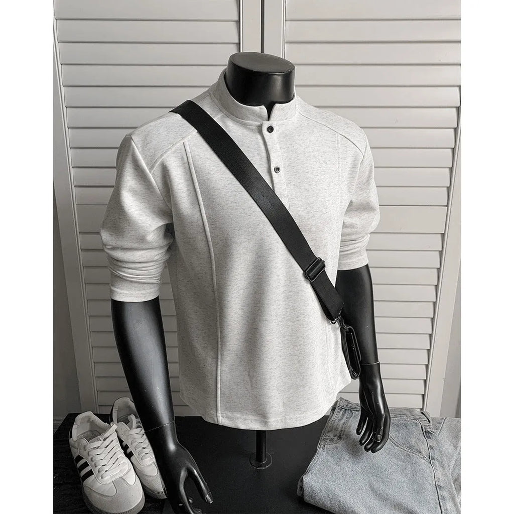 Men's patchwork stand-up collar sweater in black with asymmetric shoulder and long sleeves, loose fit