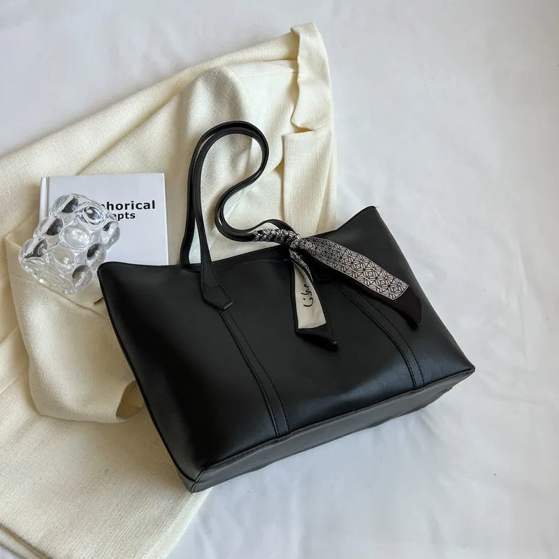 Large capacity bucket-style tote bag in multiple colour options with sandwich pocket exterior