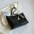 Large capacity bucket-style tote bag in multiple colour options with sandwich pocket exterior