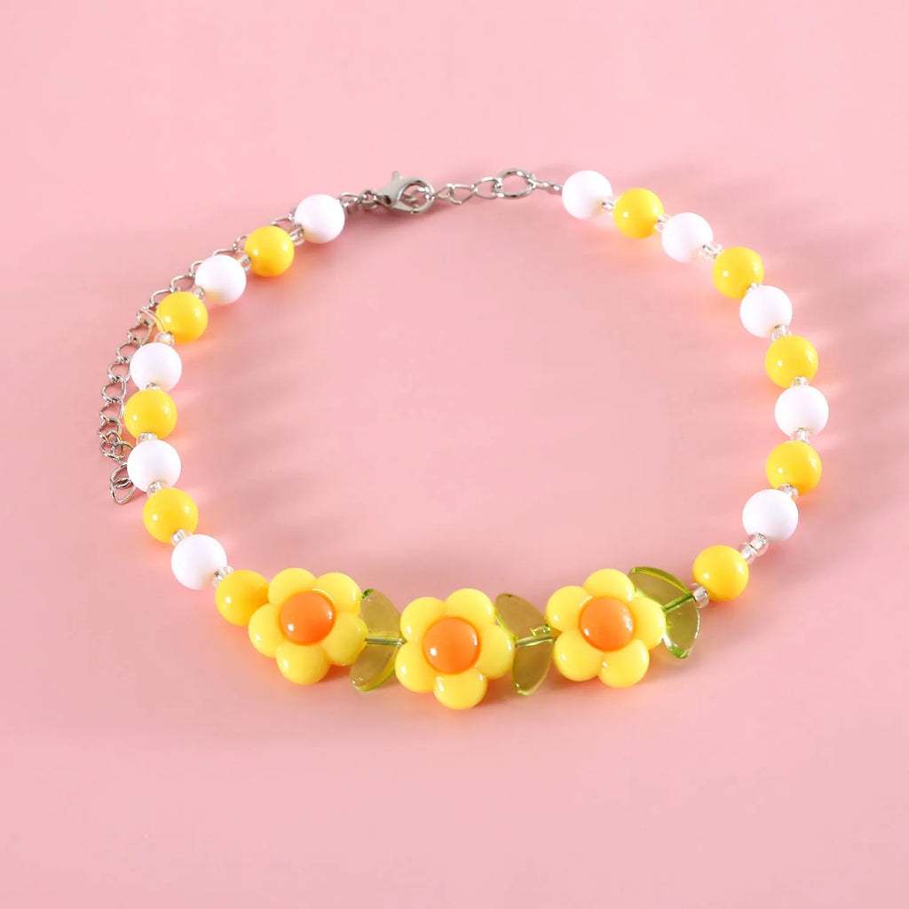Colourful plastic bead cat necklace with small flower pattern on adjustable cord