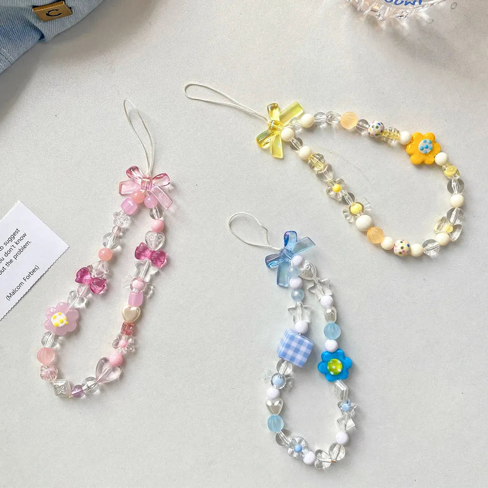 Colourful beaded flower mobile phone lanyard on rope with blue, pink, and yellow options