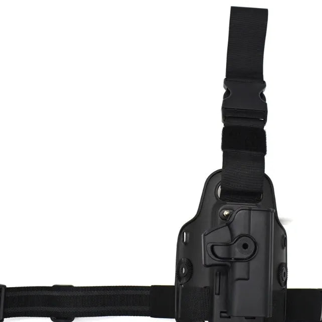 Green tactical plastic leg holster attached to a waist plate, showing quick-pull opening.