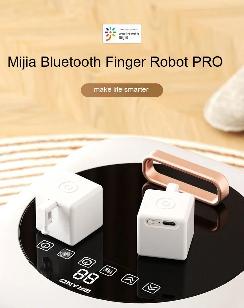 Intelligent Bluetooth finger robot voice control remote controller white on table