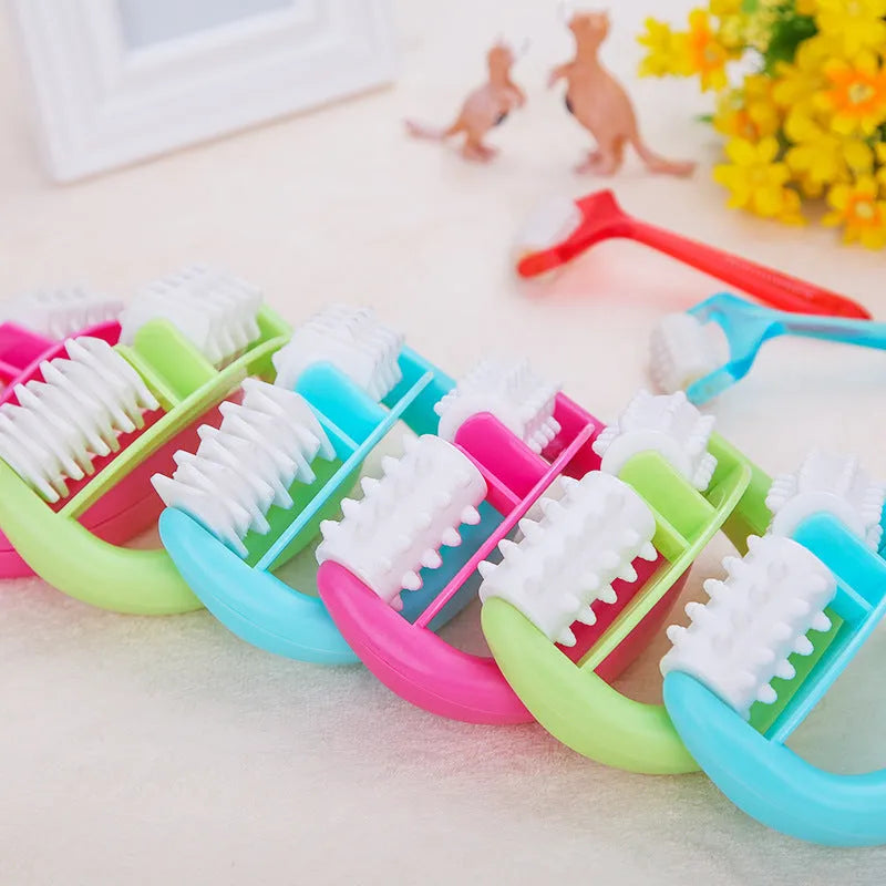 Handheld anti-cellulite massager roller with dot wheels in blue, green, and rose red colours on white background